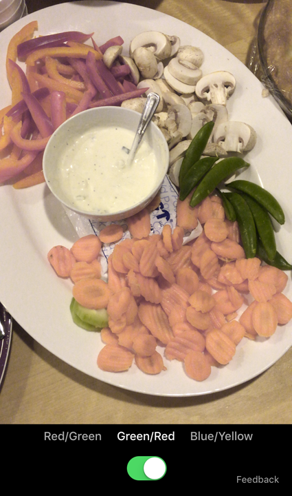 Color Binoculars enhanced photo of a dinner including sliced carrots