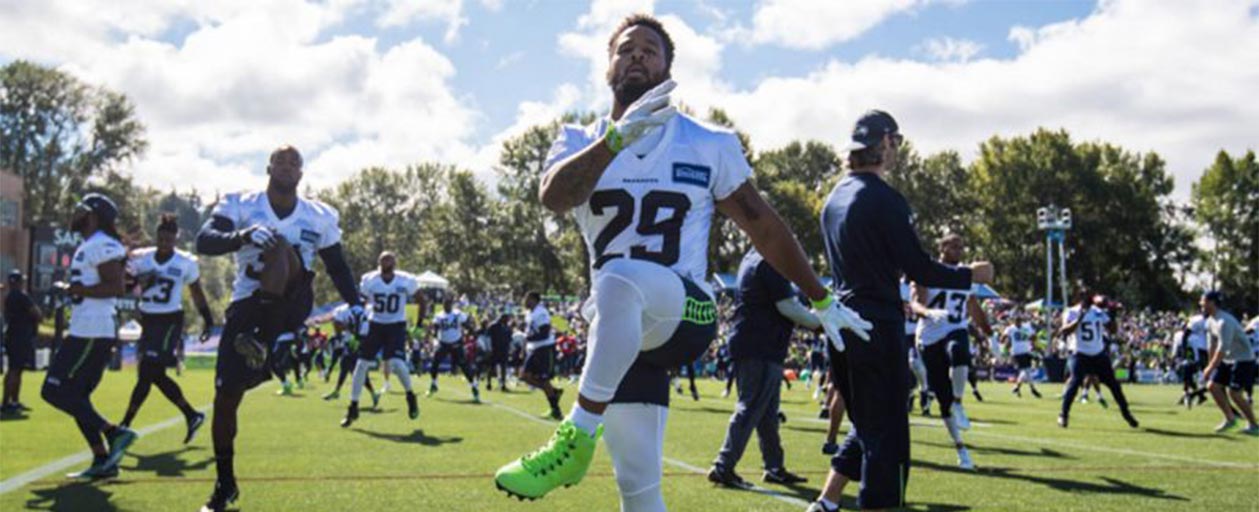 a football player kicking the ball